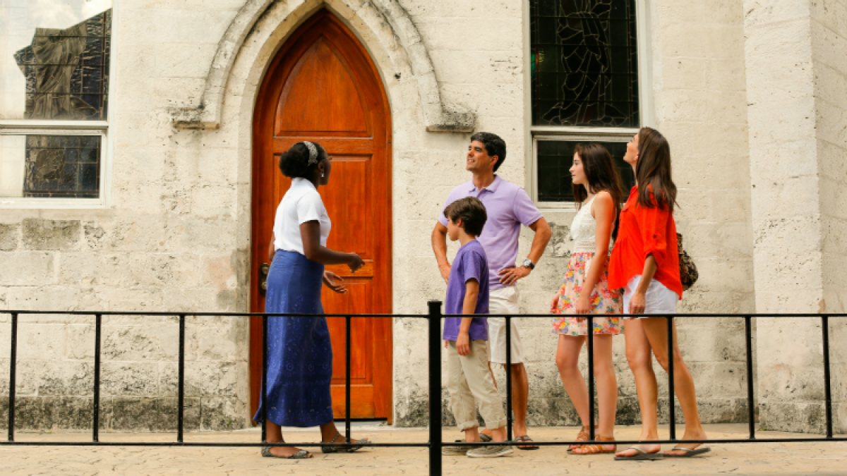 a group of people standing in front of a building